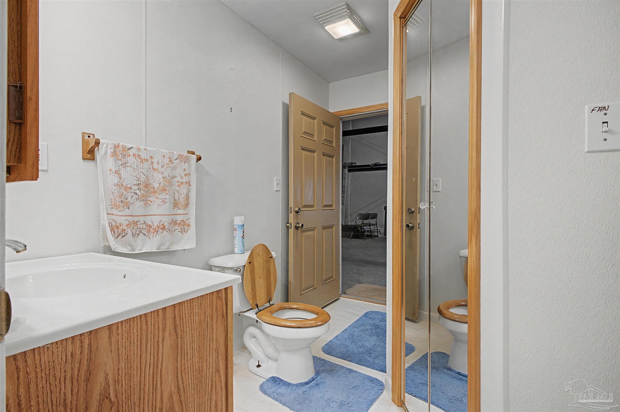 3401 Rocky Road Jay, FL 32565 - Photo 16 of 45 a bathroom with a toilet shower and a sink