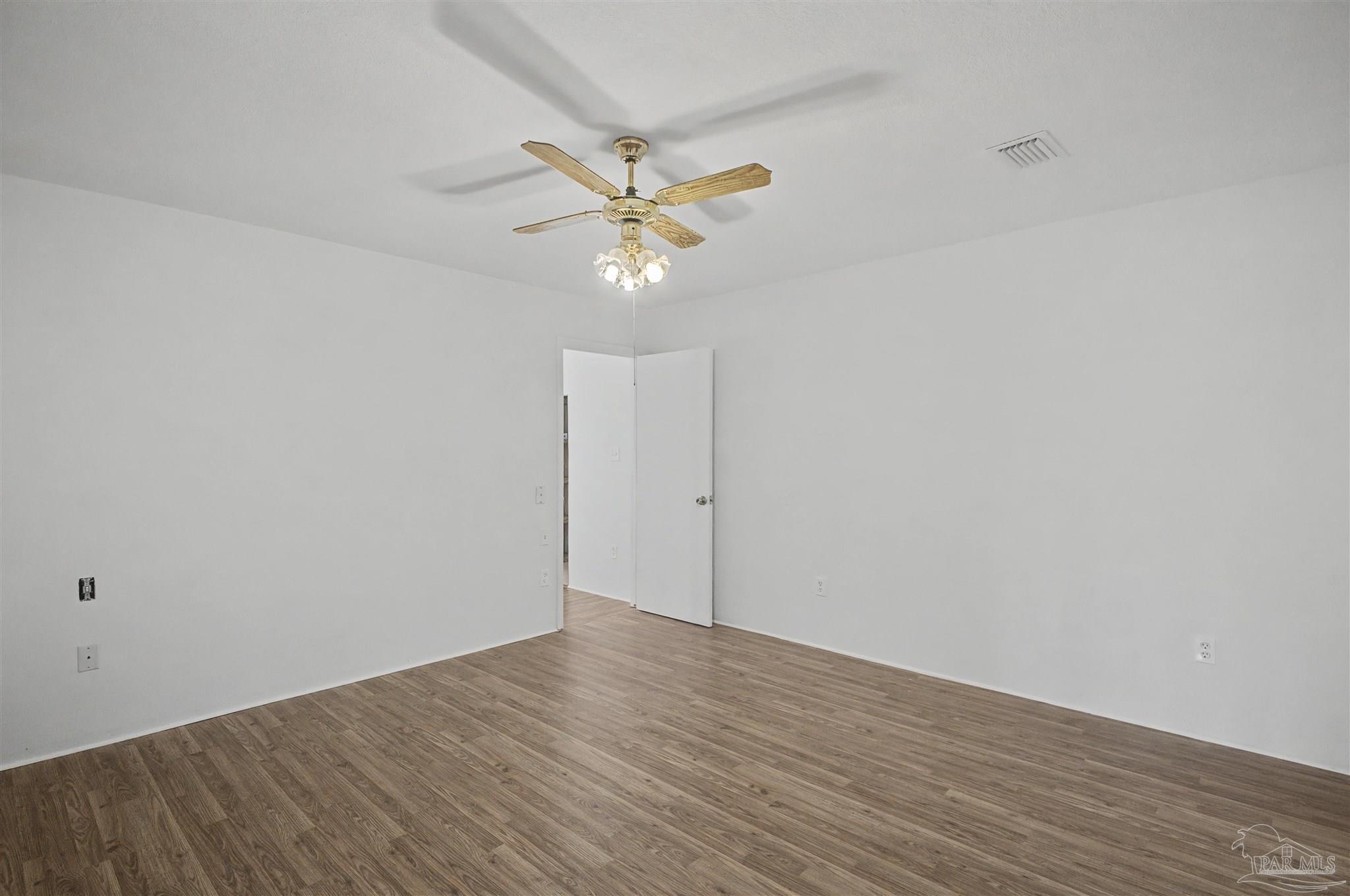 3401 Rocky Road Jay, FL 32565 - Photo 17 of 49 wooden floor in an empty room