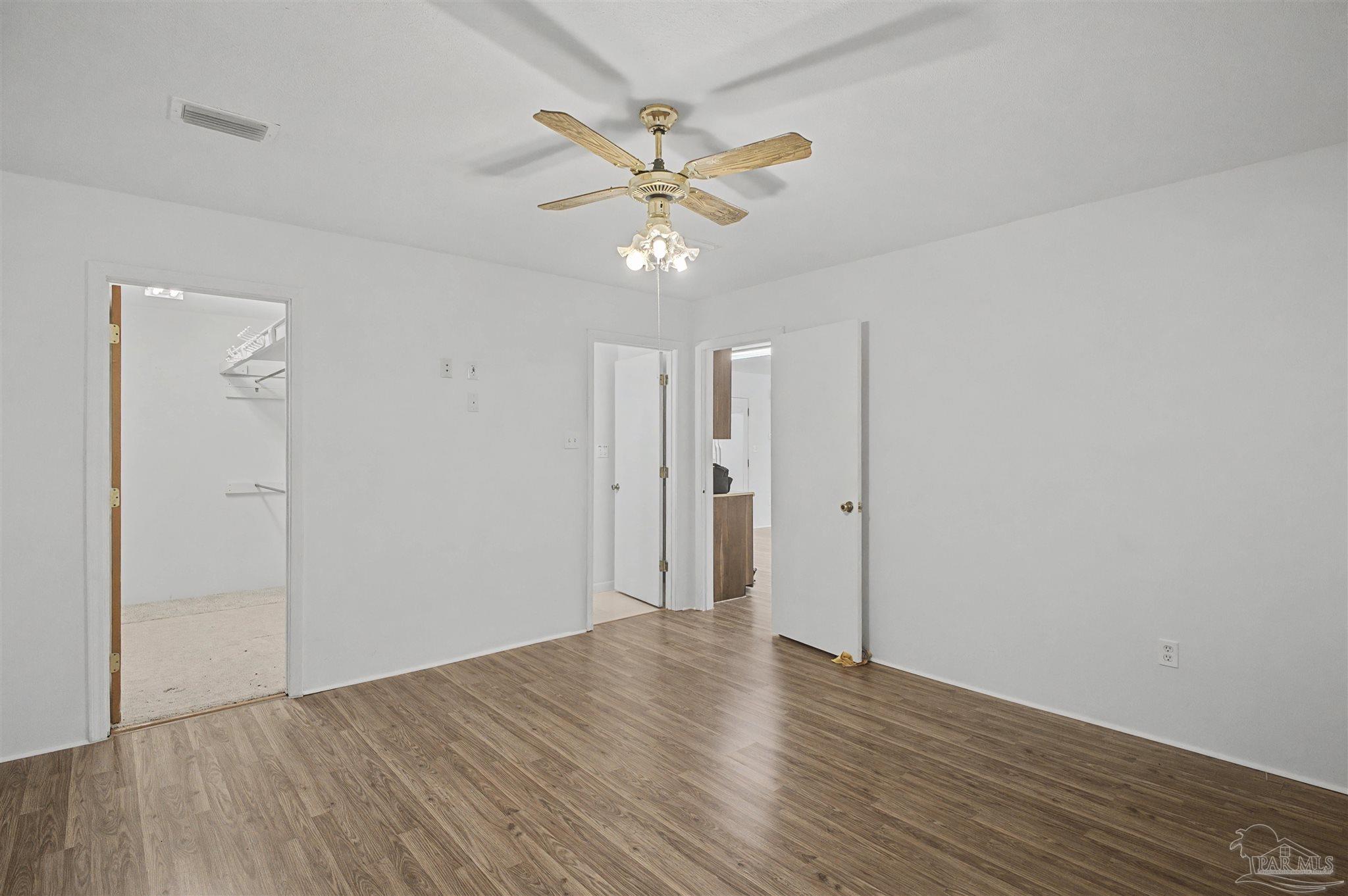 3401 Rocky Road Jay, FL 32565 - Photo 18 of 49 a view of a livingroom with a ceiling fan & wooden floor
