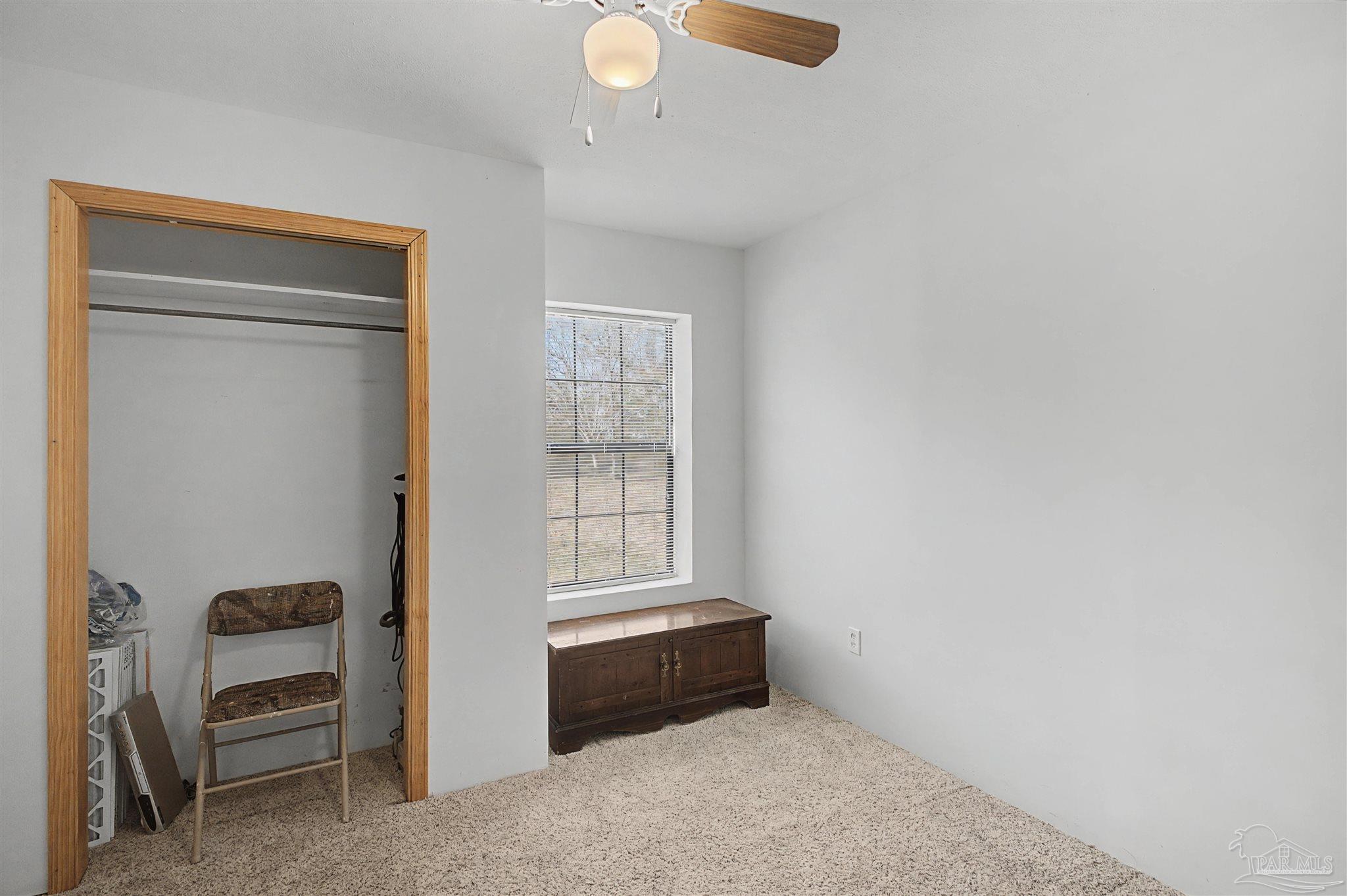 3401 Rocky Road Jay, FL 32565 - Photo 18 of 45 a room with furniture and a window