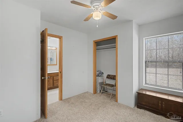 a view of room with workspace and windows