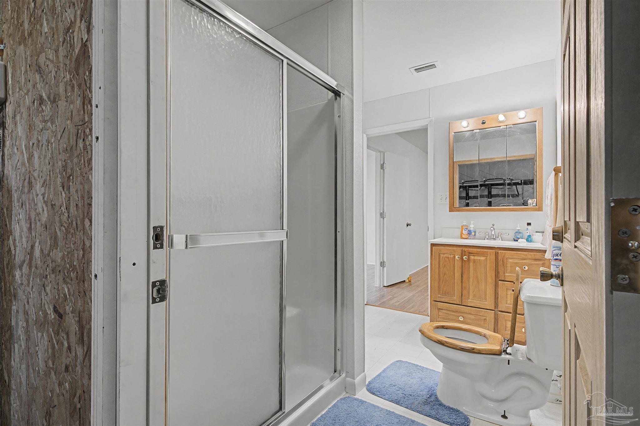 3401 Rocky Road Jay, FL 32565 - Photo 21 of 49 a bathroom with a sink and mirror
