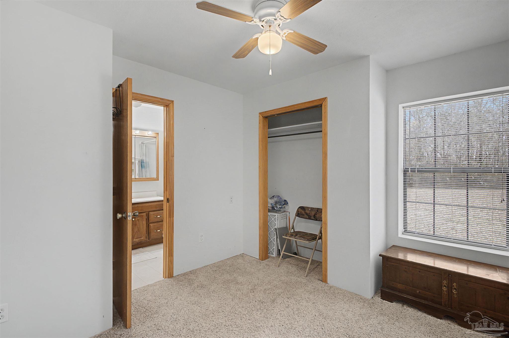 3401 Rocky Road Jay, FL 32565 - Photo 23 of 49 a view of room with workspace and windows