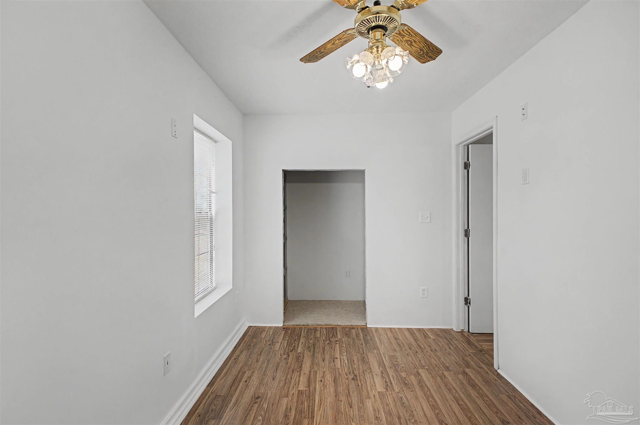 3401 Rocky Road Jay, FL 32565 - Photo 23 of 45 wooden floor in an empty room with a window