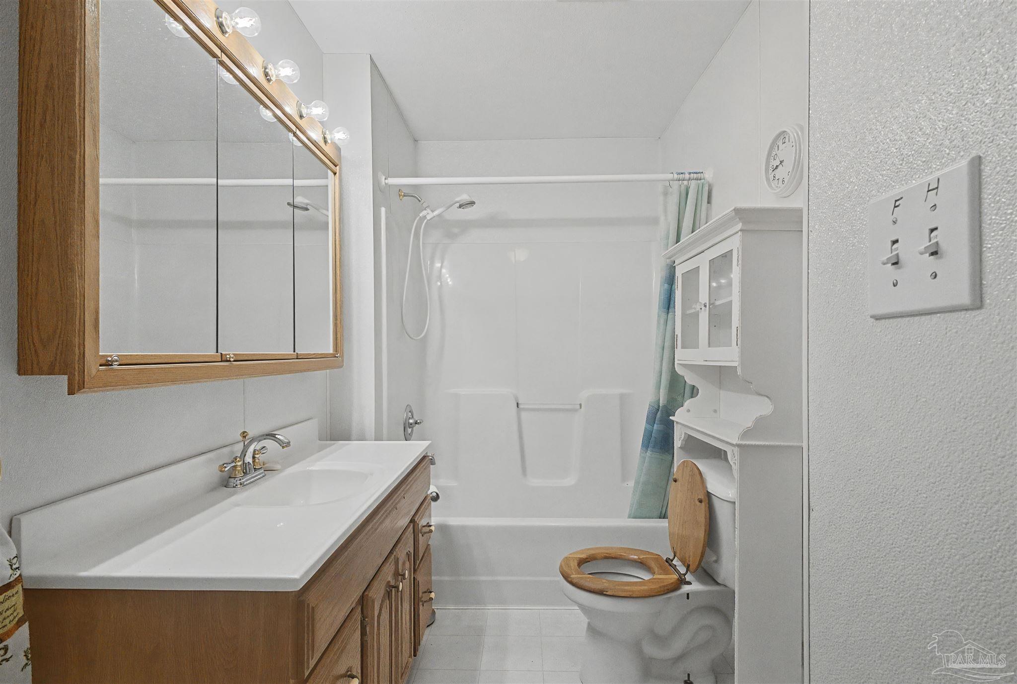 3401 Rocky Road Jay, FL 32565 - Photo 24 of 49 a bathroom with a sink a toilet and shower