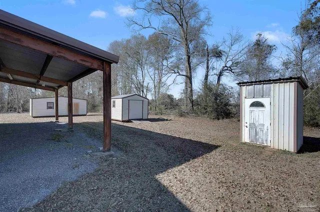 a view of a backyard of the house