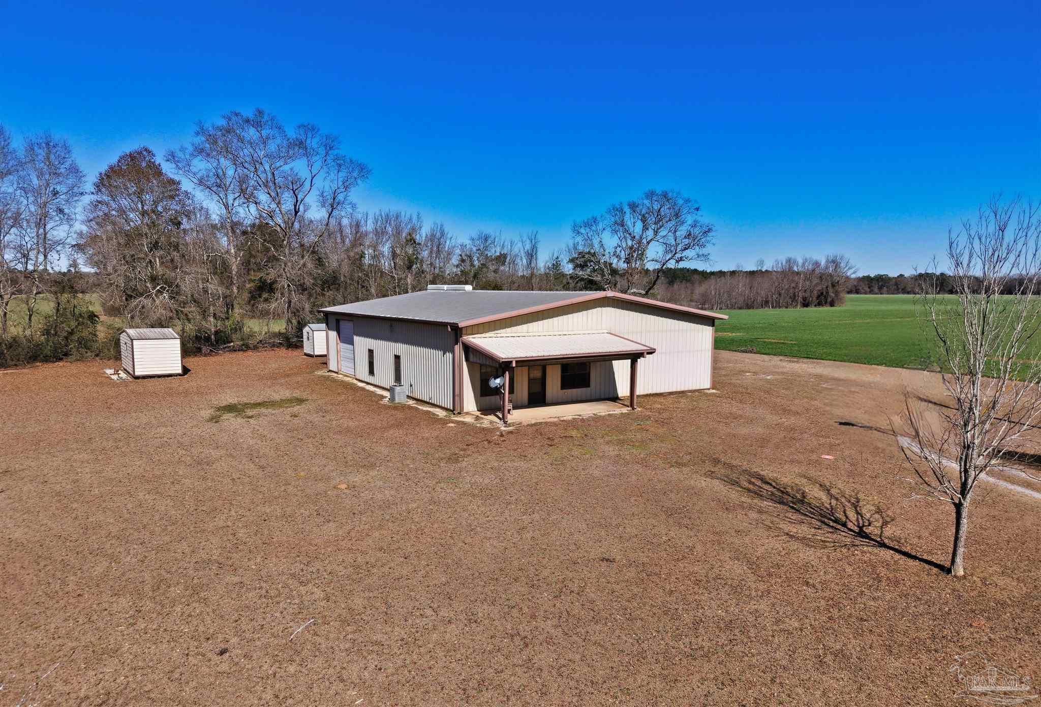 3401 Rocky Road Jay, FL 32565 - Photo 31 of 45 a view of a house with a yard and a large tree
