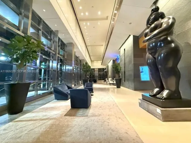 a view of a patio with couches chairs and potted plants