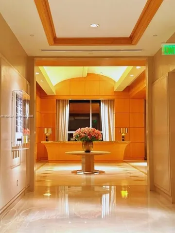 a view of a living room with a large window