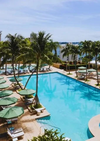 a view of a swimming pool with lounge chairs