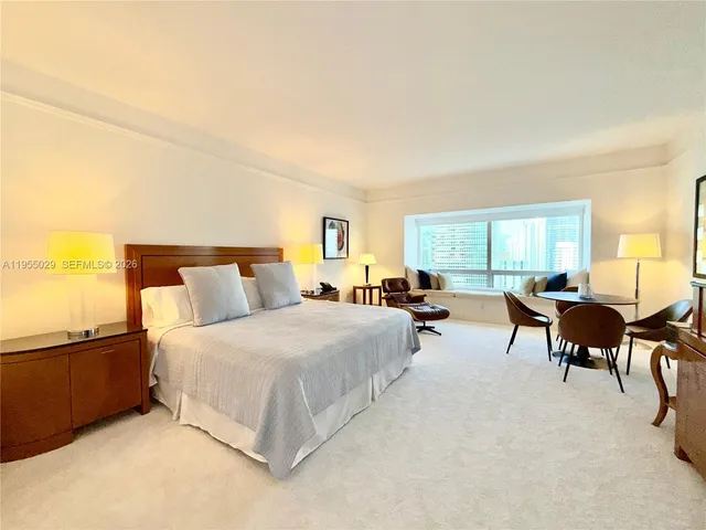 a bed room with furniture and a window