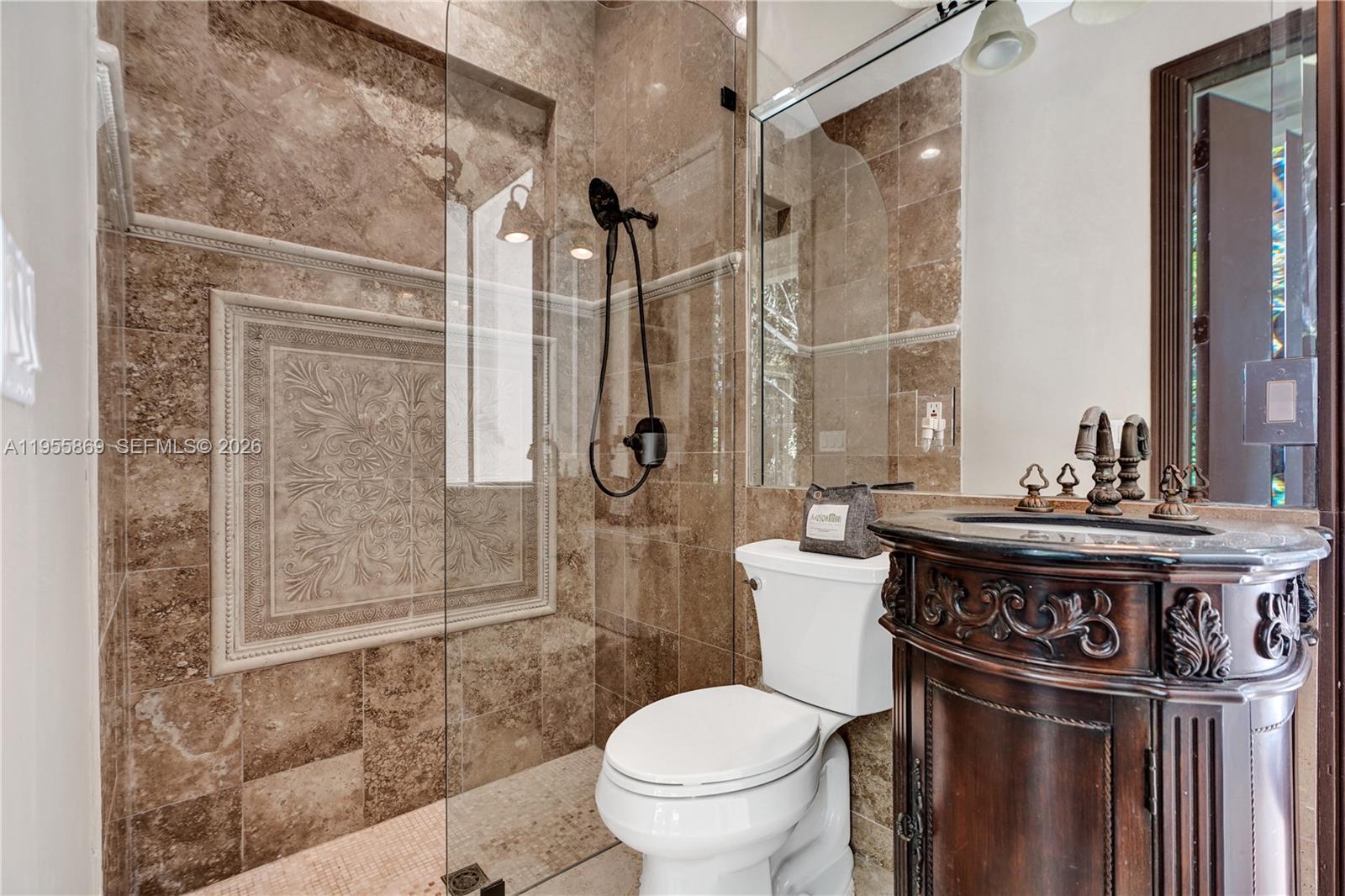 3175 Hunter Road Weston, FL 33331 - Photo 30 of 45 a bathroom with a sink a toilet and shower