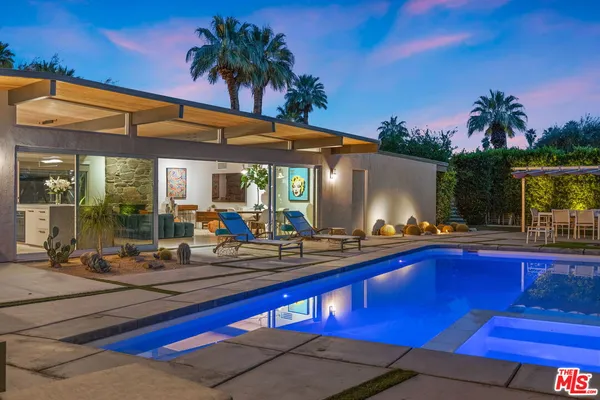 a house view with a swimming pool