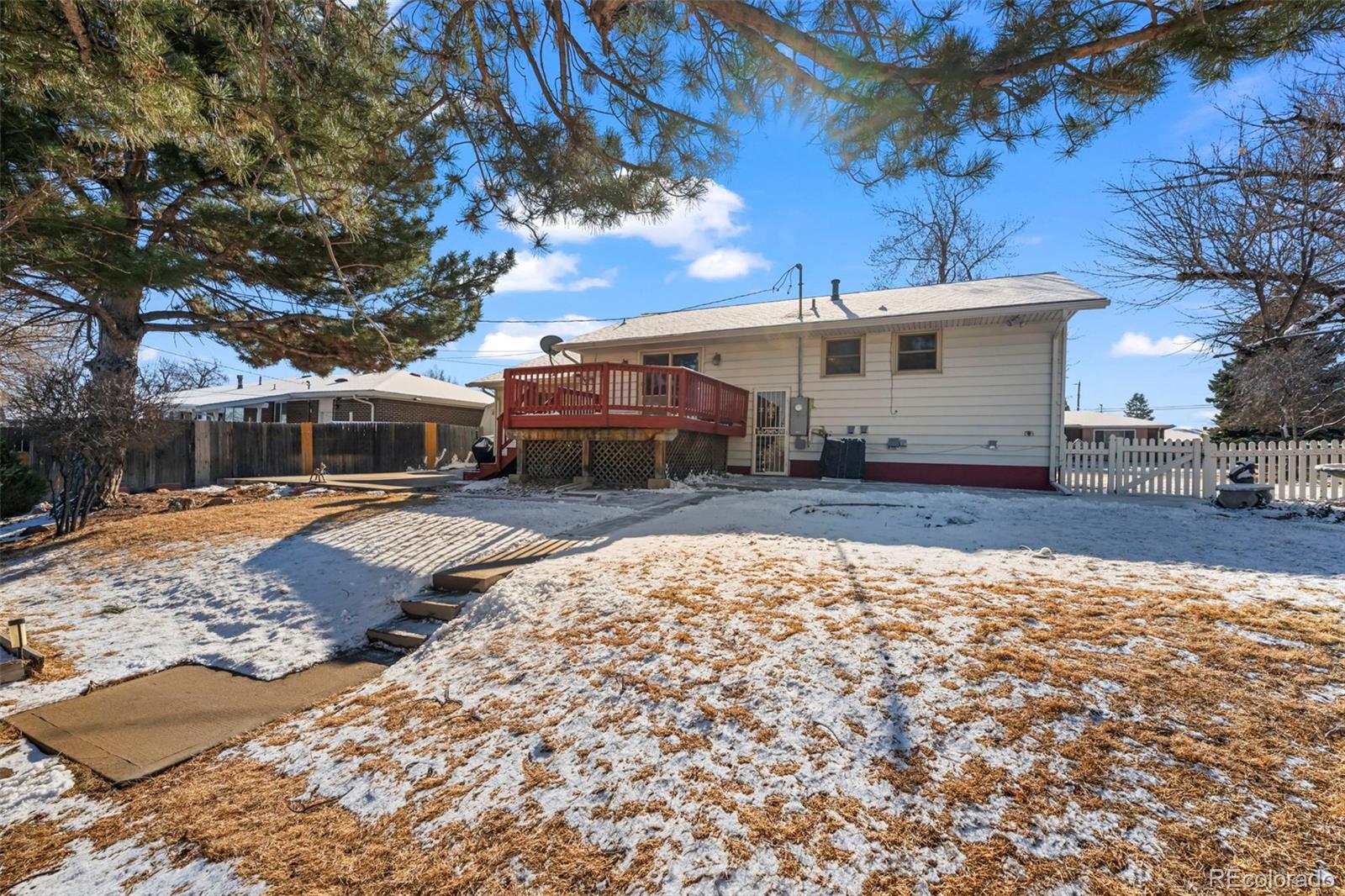 8213 Adams Way Denver, CO 80221 - Photo 20 of 22 a front view of a house with a yard