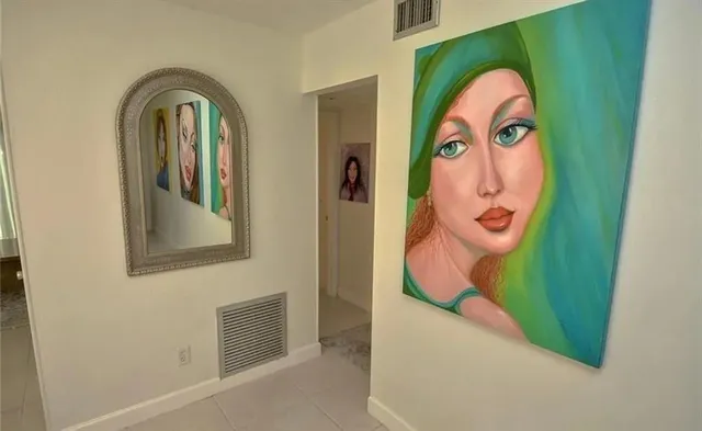 a bathroom with a mirror and a sink