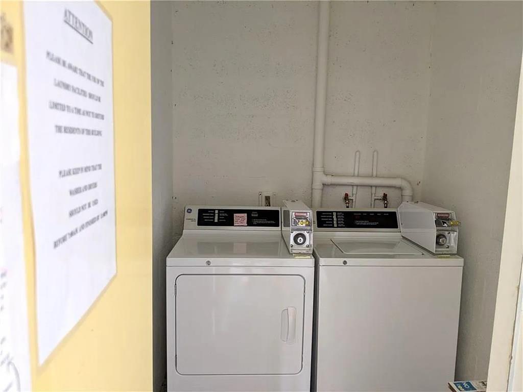1225 Northwest 21st Street, Unit 3507 Stuart, FL 34994 - Photo 15 of 18 a utility room with dryer and washer