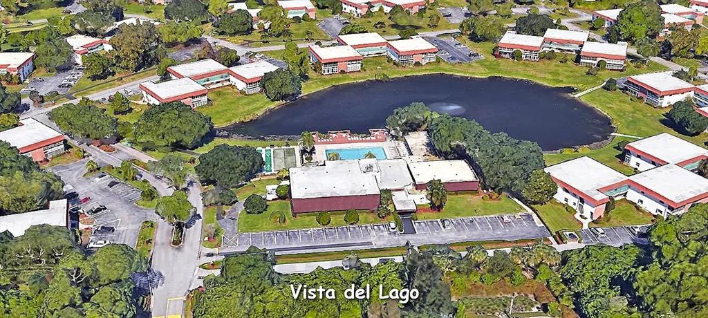 1225 Northwest 21st Street, Unit 3507 Stuart, FL 34994 - Photo 17 of 18 an aerial view of residential houses with outdoor space