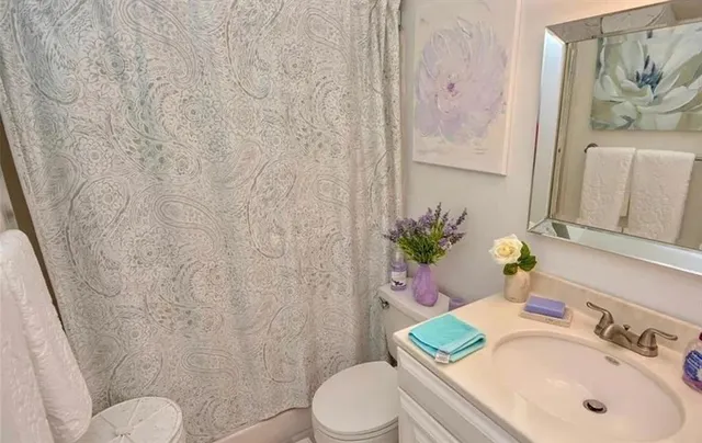 a bathroom with a sink and toilet