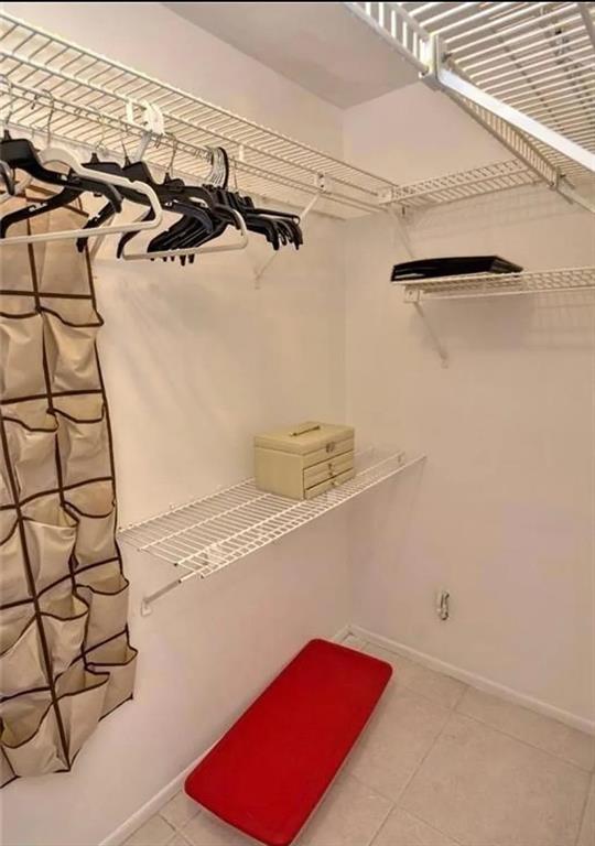 1225 Northwest 21st Street, Unit 3507 Stuart, FL 34994 - Photo 10 of 18 a view of a room with racks on the wall