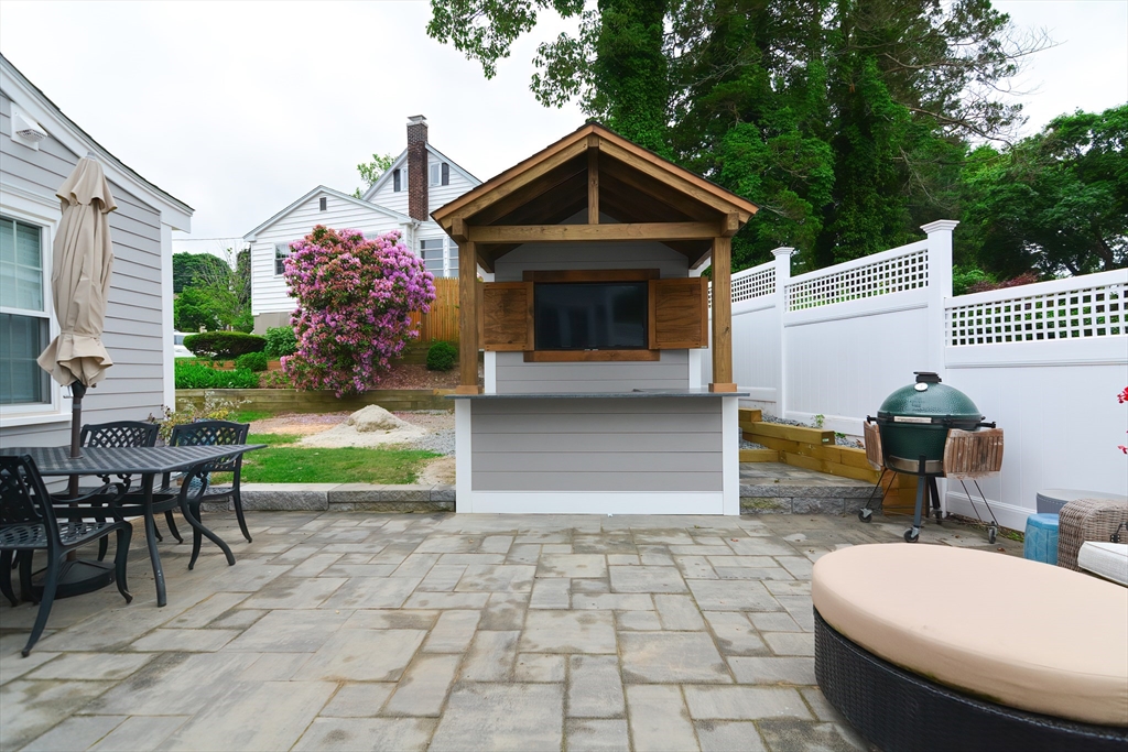 1133 Brook Road Milton, MA 02186 - Photo 12 of 40 a front view of a house with garden