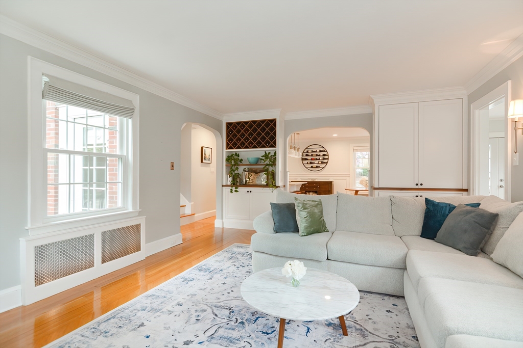 1133 Brook Road Milton, MA 02186 - Photo 16 of 40 a living room with furniture and a wooden floor