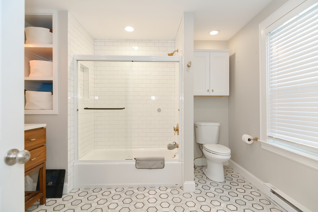 1133 Brook Road Milton, MA 02186 - Photo 17 of 40 a bathroom with a toilet a sink and a bathtub