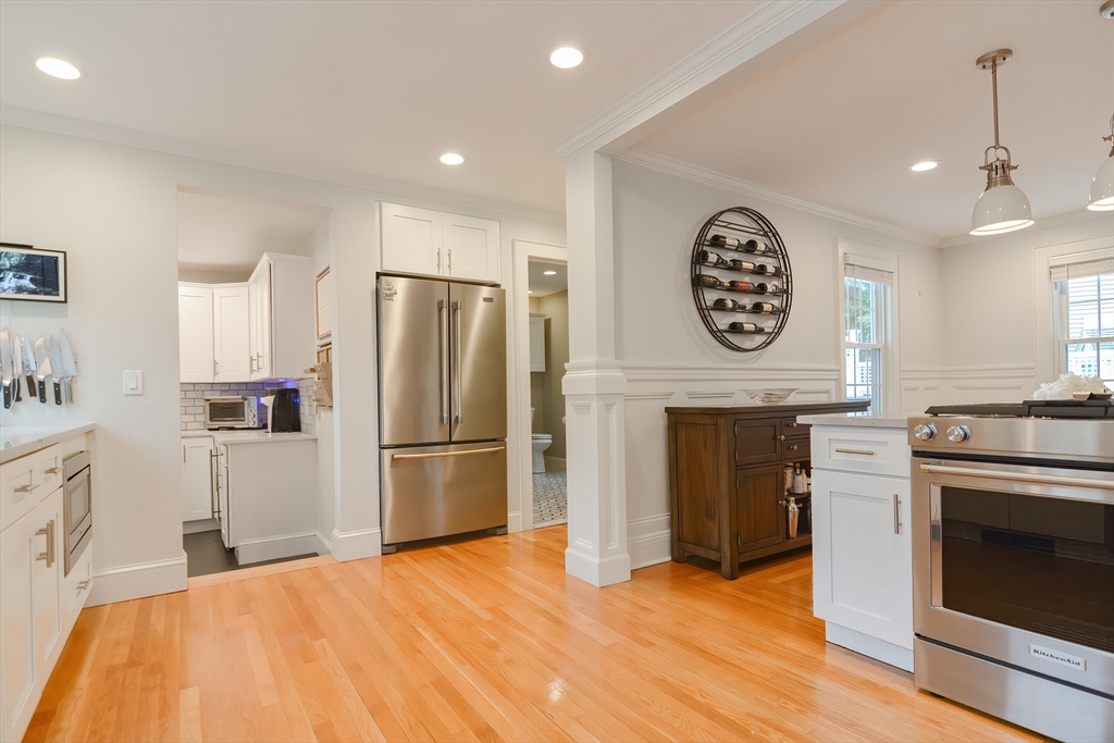 1133 Brook Road Milton, MA 02186 - Photo 21 of 40 a kitchen with a refrigerator a stove top oven and a kitchen view