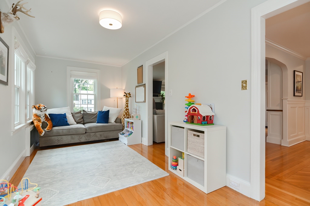 1133 Brook Road Milton, MA 02186 - Photo 30 of 40 a living room with furniture and a wooden floor