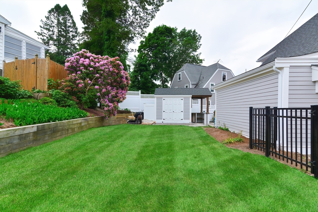1133 Brook Road Milton, MA 02186 - Photo 4 of 40 a view of a house with a back yard