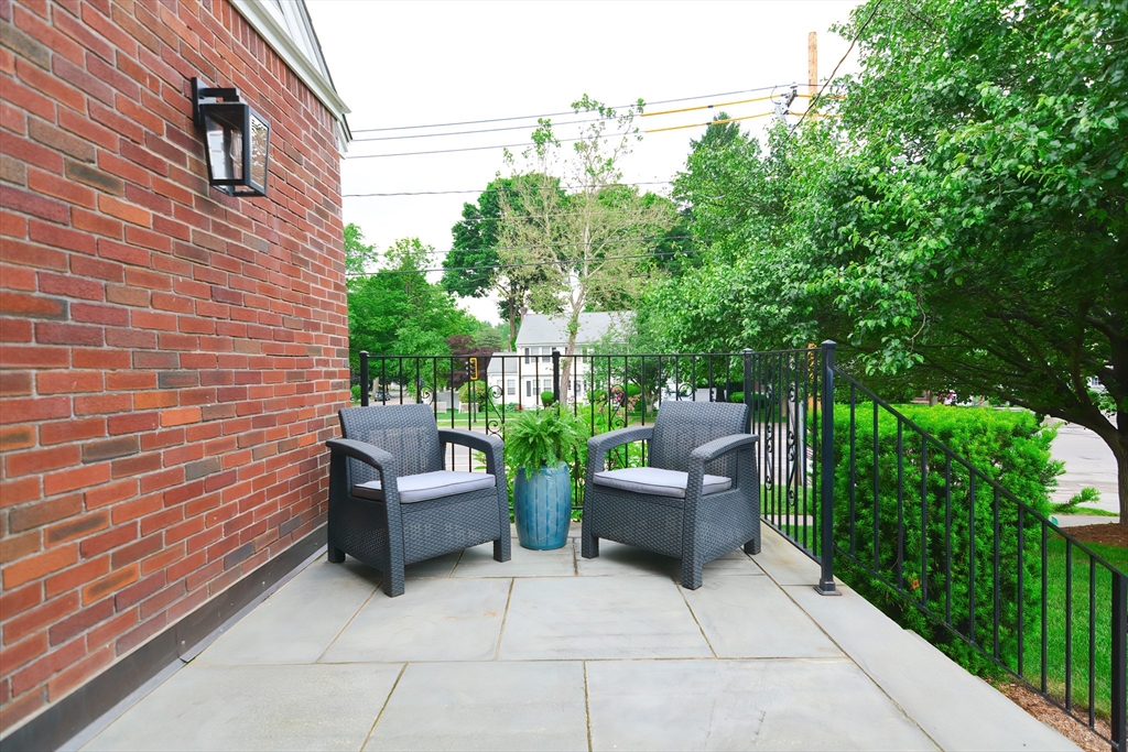 1133 Brook Road Milton, MA 02186 - Photo 8 of 40 a view of a patio with couches and potted plants
