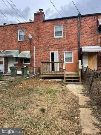 a backyard of a house with yard fire pit and outdoor seating