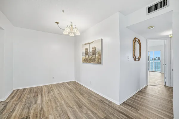 a kitchen with a stove and white cabinets