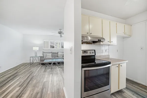 a kitchen with a sink and cabinets