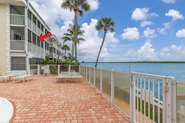 a view of balcony with wooden floor and bench