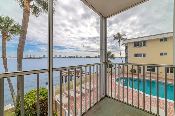 a view of a room with wooden floor and window