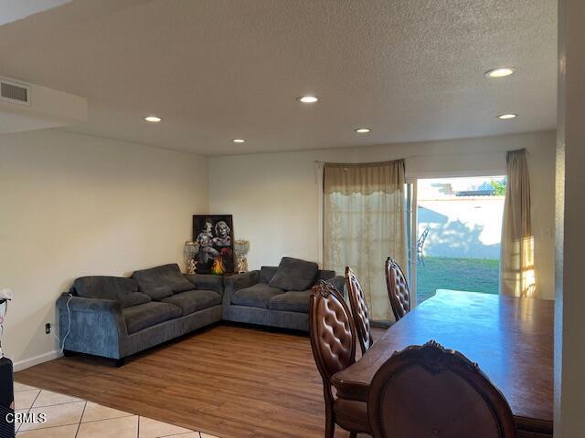 2230 Lassen Street Oxnard, CA 93033 - Photo 2 of 13 a living room with furniture and a floor to ceiling window