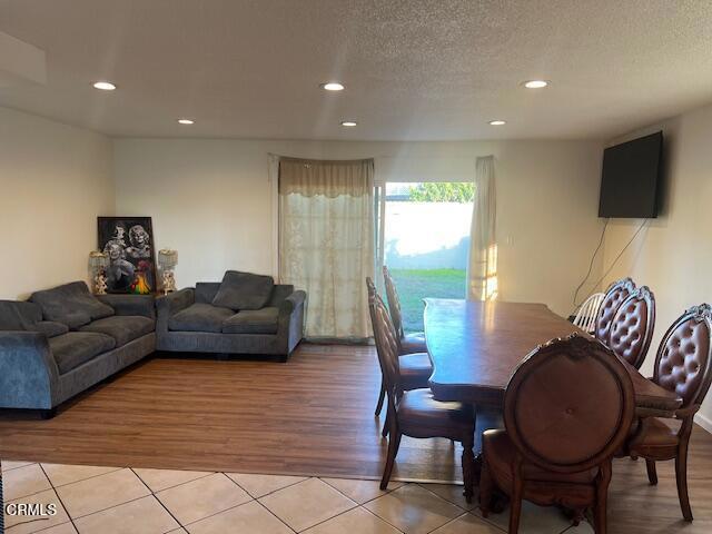 2230 Lassen Street Oxnard, CA 93033 - Photo 3 of 13 a living room with furniture and a flat screen tv