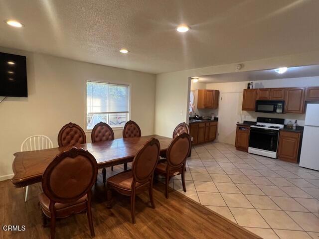 2230 Lassen Street Oxnard, CA 93033 - Photo 4 of 13 a view of a dining room with furniture and wooden floor