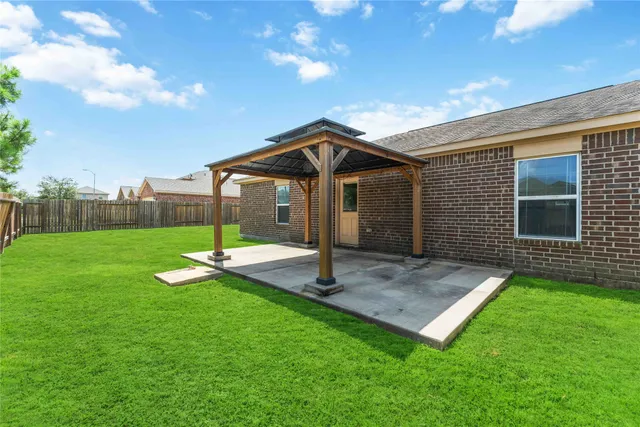 a view of a house with a yard porch and sitting area