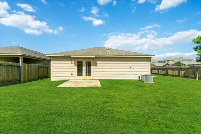 a view of a backyard of the house