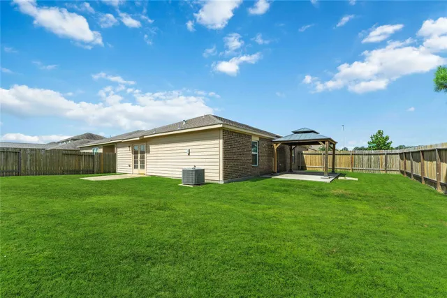 a house view with swimming pool and garden