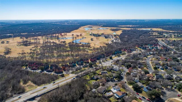 an aerial view of houses with outdoor space