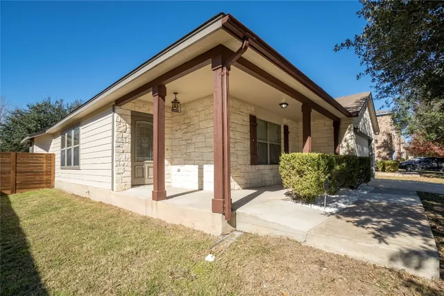 a view of a building with potted plants