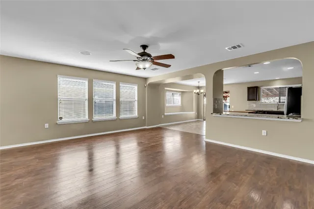 a view of a kitchen with a stove cabinets and a wooden floor