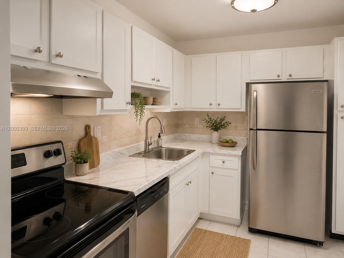 8050 West McNab Road, Unit 206 Tamarac, FL 33321 - Photo 33 of 37 a kitchen with granite countertop a refrigerator stove and sink