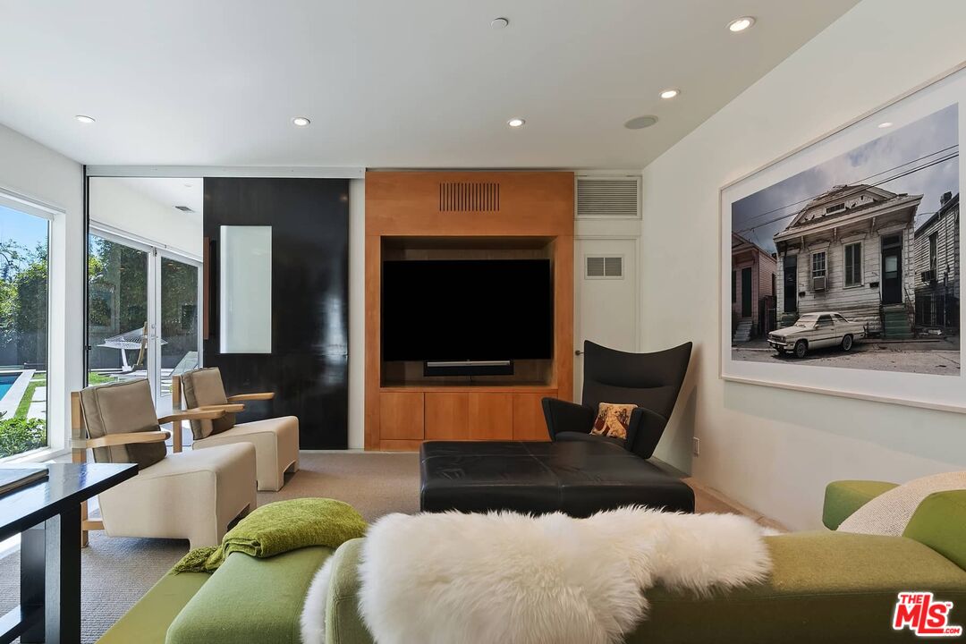 12310 Rochedale Lane Los Angeles, CA 90049 - Photo 13 of 53 a living room with furniture and a flat screen tv