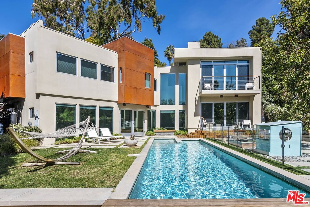 12310 Rochedale Lane Los Angeles, CA 90049 - Photo 2 of 53 front view of a house with a yard