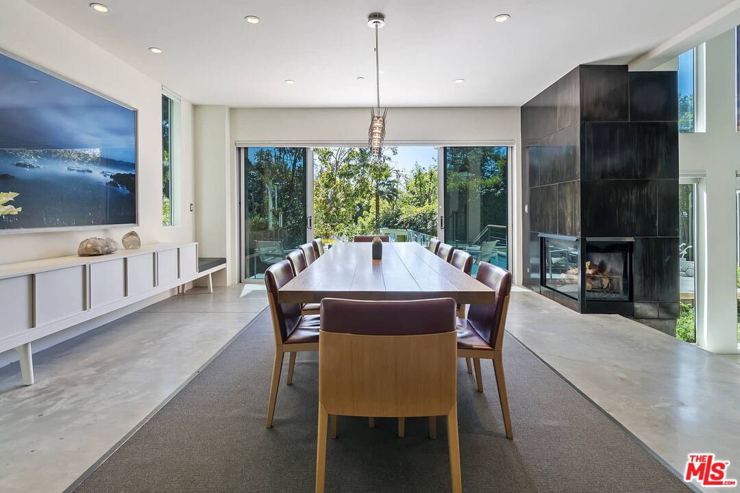 12310 Rochedale Lane Los Angeles, CA 90049 - Photo 23 of 53 a dining room with furniture and window
