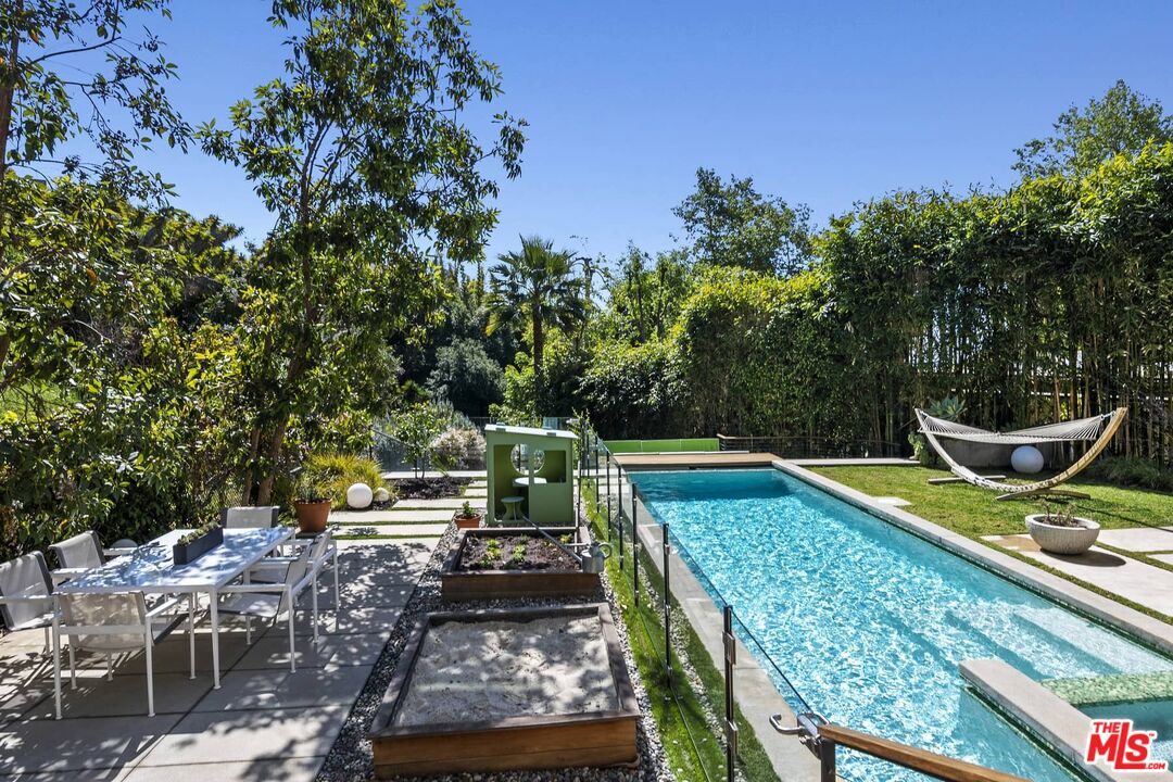 12310 Rochedale Lane Los Angeles, CA 90049 - Photo 25 of 53 a view of a chairs and table on the deck