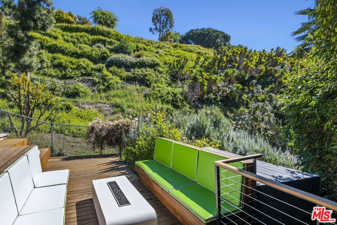 12310 Rochedale Lane Los Angeles, CA 90049 - Photo 28 of 53 a view of a backyard with sitting area